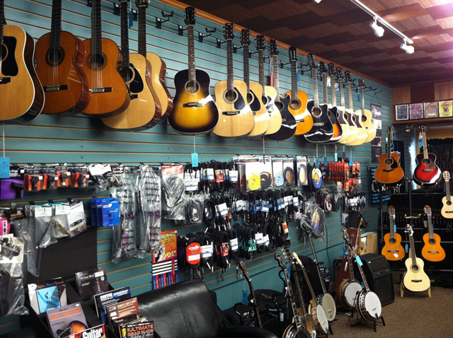 Acoustic guitars, electric guitars, banjos, guitar straps, guitar strings, and guitar cases at The Symphony Music Shop in North Dartmouth, MA