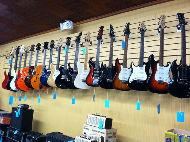 Electric guitars, acoustic guitars, banjos, guitar straps, guitar strings, and guitar cases at The Symphony Music Shop in North Dartmouth, MA Electric guitars, acoustic guitars, banjos, guitar straps, guitar strings, and guitar cases at The Symphony Music Shop in North Dartmouth, MA